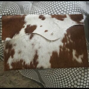 Brown and White Cowhide Clutch